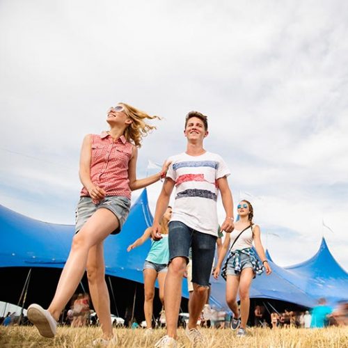 teenagers-at-summer-music-festival-in-front-of-PSUEN3F.jpg